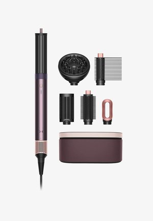 Haarstylingsapparaat in paars en zwart, inclusief verschillende mondstukken en een bijpassende opbergdoos. Bevat textuurgrips en bedieningsknoppen.