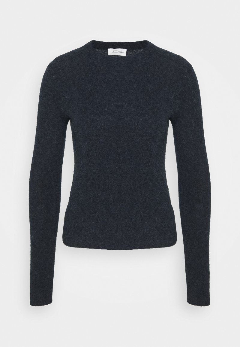 Pull en bleu marine avec des manches longues, un col rond, un tissu texturé et un design ajusté. Silhouette simple et polyvalente.