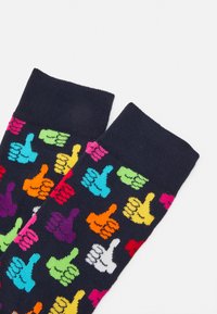 Multicolored socks featuring a pattern of raised thumbs in pink, green, yellow, blue, and purple on a dark background. Cotton blend material.