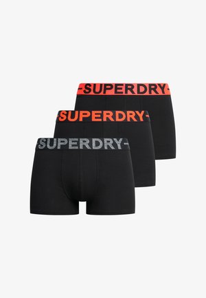 Schwarze Boxer Shorts mit kontrastierenden elastischen Taillengürteln in Rot und Grau mit "SUPERDRY"-Label. Glattes Baumwollmaterial, körpernahe Passform.