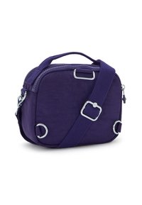 Small purple crossbody bag with adjustable strap, handle, silver metal rings, and zipper closure on a white background.