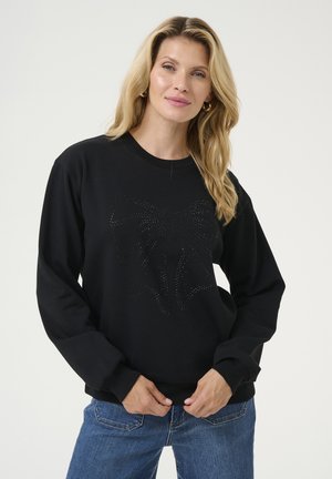 Schwarzer Sweatshirt mit langen Ärmeln, ausgestattet mit einem strukturierten Schleifendessin aus Strasssteinen auf der Vorderseite. Lockere Passform, runder Ausschnitt.