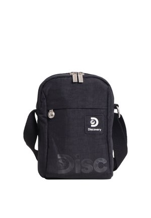 Schwarze kompakte Umhängetasche mit Reißverschluss-Hauptfach, Fronttasche, verstellbarem Riemen und „Discovery“-Logopatch auf der Vorderseite.