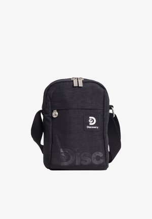 Schwarze kompakte Umhängetasche mit Reißverschluss-Hauptfach, Fronttasche, verstellbarem Riemen und „Discovery“-Logopatch auf der Vorderseite.