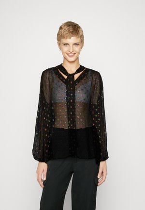 Schwarze transparente Bluse mit bunten bestickten Punkten, langen Ärmeln und einem Schlüsselloch-Ausschnitt. Verfügt über ein plissiertes Design und eine weiche Textur.