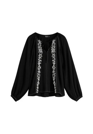 Zwarte blouse met een losse pasvorm, voorzien van witte bloemenborduursels aan de voorkant en een strikhalslijn. Lange ballonmouwen en zachte textuur.