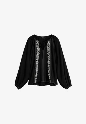 Blusa negra de corte holgado, con bordado floral blanco en la parte delantera y un escote con lazo. Mangas largas tipo globo y textura suave.