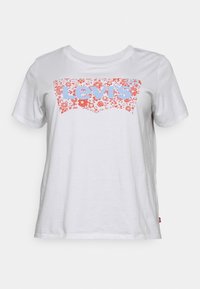 T-shirt blanc en coton à manches courtes, avec un logo Levi's floral en bleu et rouge. Design classique à col rond avec une texture douce.