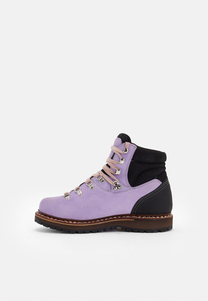 Purple suede hiking boot with black accents, metal eyelets, and beige laces. Features a sturdy rubber sole and reinforced heel for support.