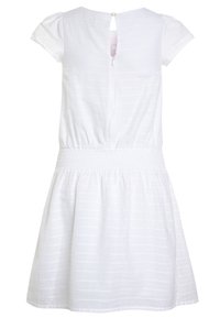 Biała bawełniana sukienka z krótkimi bufkami, elastycznym w pasie, spódnica w kształcie litery A oraz wycięciem w kształcie łezki na plecach z zapięciem na guzik. Teksturowany wzór w paski.
