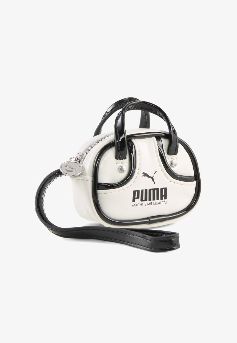 Pequeño bolso de muñeca Puma blanco y negro con dos asas, cierre de cremallera y correa de muñeca desmontable con tirador de cremallera con marca.