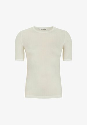 Top blanco de manga corta y con relieve, con un escote redondo y bordes en forma de onda. Tejido suave con una textura sutil y pequeños patrones de puntos a lo largo.