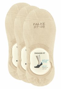 Beige lave sneakersokker med ribbe-struktur, som har et anti-sklisystem. Pakken inneholder tre par med merkeøtt på toppen.