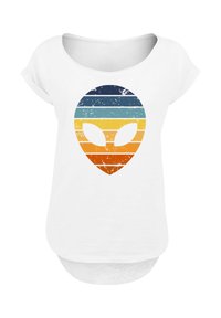 White short-sleeve t-shirt featuring a distressed alien face design with horizontal stripes in blue, teal, orange, and yellow.