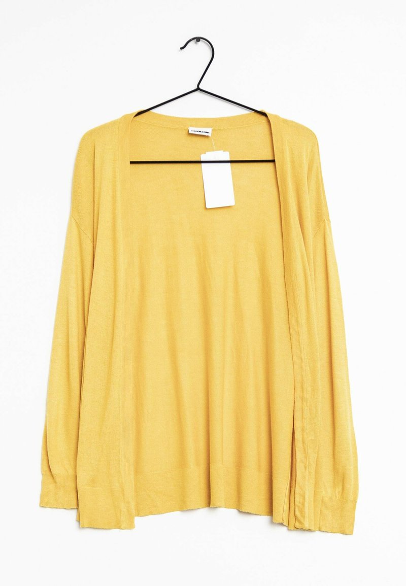 Gul, långärmad cardigan i mjukt material, med öppen front, avslappnad passform och en tagg hängande från halsringningen.