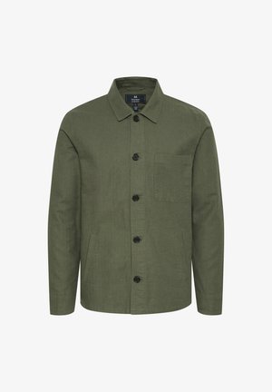 Olajzöld dzseki textúrált anyagból, gombos elülső résszel, gallérral és egy mellzsebekkel, fekete gombokkal díszítve.