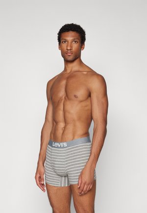 Boxer shorts gris rayés avec une taille unie grise arborant le logo "Levi's". Texture de tissu doux et design ajusté.