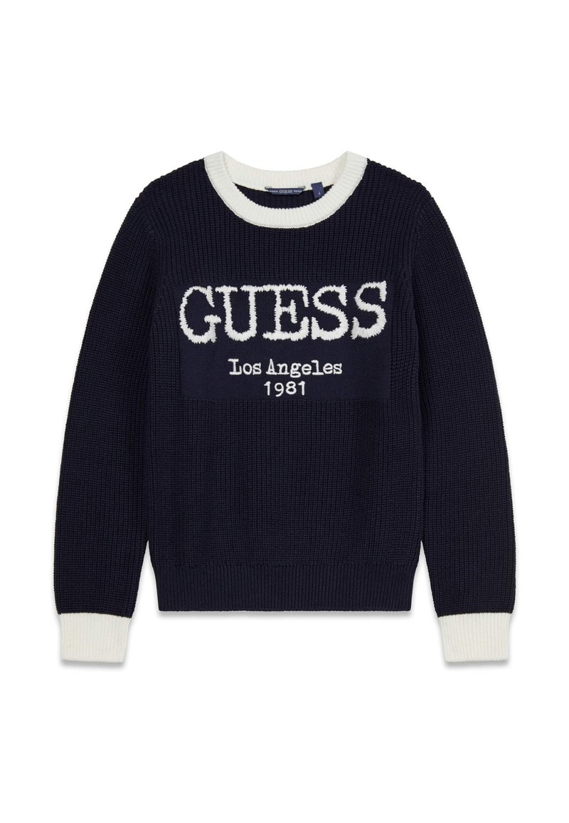 Pull en tricot bleu marine avec accents côtelés blancs et col rond. Présente l'inscription "GUESS Los Angeles 1981" en lettres blanches audacieuses sur le devant.