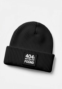 Black ribbed beanie with a turned-up cuff, featuring a rectangular patch with white text reading "404: MOTIVATION NOT FOUND."