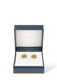 Gold cufflinks with a textured mesh pattern, displayed in a navy blue box with a white plush interior and a subtle logo.