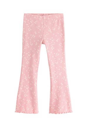 Rosa ribbede flagrende bukser med spredt lille hvidt blomsterprint og krøllede kanter.