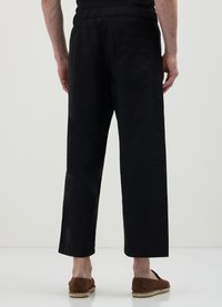 Calliope CORTI WIDE  - Jogginghose - nero