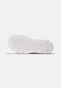 White sneaker sole with textured tread, featuring a patterned surface and circular logo. Flat design with distinct ridges and grooves.
