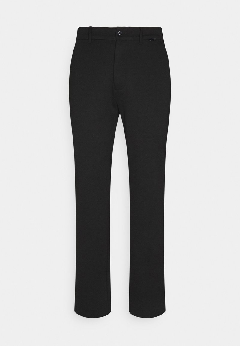 Pantalon noir slim avec passants de ceinture, bouton devant et fermeture éclair, présenté à plat sur un fond clair.