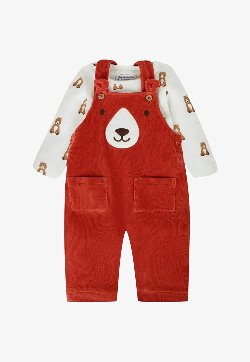 Sarkanie velūra kombinezoniņi zīdainim ar lāča seju uz krūtīm, kopā ar baltu garroku kreklu ar brūna lāča apdruku.