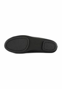 Black shoe sole with a flat, smooth texture, featuring a rounded toe, subtle stitching, and a central rubber accent for grip.