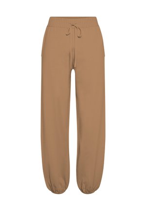 Hnědé, lehké tepláky s širokým elastickým pasem a stahovacím provázkem. Mají zúžené lemy u kotníků a boční kapsy. Měkká textura.