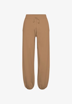 Braune, leichte Jogginghose mit weitem, elastischem Bund und Kordelzug. Mit verengten Bündchen an den Knöcheln und seitlichen Taschen. Weiche Textur.