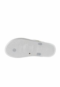 Semelle de chaussure en caoutchouc blanche avec surface texturée, motifs de grip circulaires et ovales, et deux tampons d'accent gris circulaires. Forme plate et arrondie.
