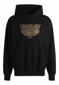 Svart hooded sweatshirt med en stor guldbroderad grafik på framsidan och en känguruficka vid midjan.