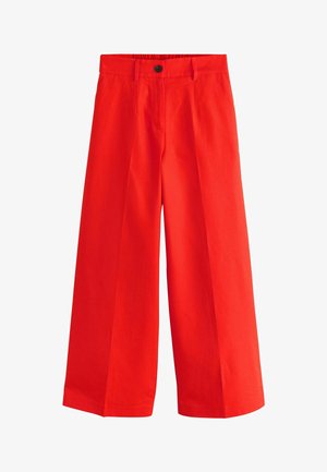 Világos piros, széles szárú nadrág övbújtatókkal, elöl gombos és cipzáras záródással, sima anyagból készült.