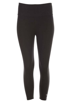 Türkiser Tanktop und schwarze Leggings an einer Person in einer Yoga-Pose. Glatter Stoff, taillierter Schnitt, sichtbare Details auf dem Tanktop.