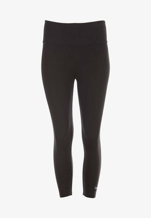 Türkiser Tanktop und schwarze Leggings an einer Person in einer Yoga-Pose. Glatter Stoff, taillierter Schnitt, sichtbare Details auf dem Tanktop.
