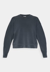Sweatshirt corto grigio scuro, con scollo a girocollo, spalle scese e cuciture a vista lungo l'orlo e i polsini. Dettaglio del logo discreto.