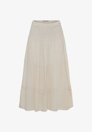 Lang beige lagdelt nederdel med bred smocket talje, lavet af let tekstureret stof.