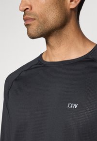 ICANIWILL TRAINING LONG SLEEVE MEN - Top dugih rukava - black