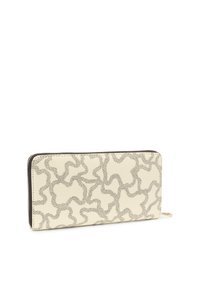 Rectangular cream wallet with black abstract squiggle pattern, black zipper along top and side edges, and gold zipper pull tab.