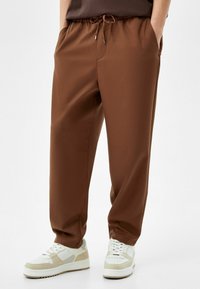 Bershka Teplákové kalhoty - brown
