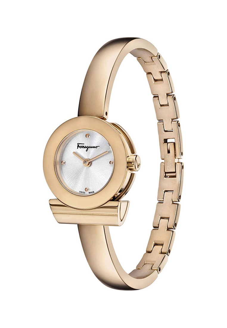Montre-bracelet dorée avec un cadran rond argenté à motif éclat de soleil, design de bracelet lié et grand logo Ferragamo. Fini élégant et poli.