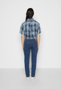 Lee RIDER - Calças de ganga justas - mid stone wash