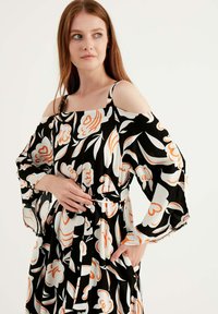 Herita Maxikjoler - black