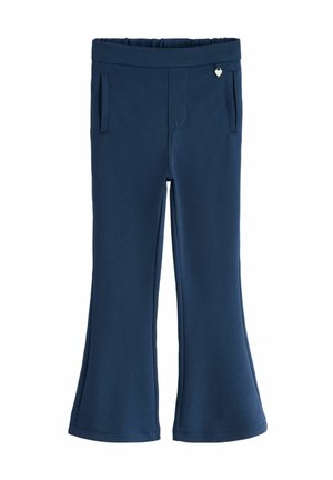 Marineblauwe wijde broek gemaakt van rekbare stof, met een elastische tailleband en twee zijzakken. Voorzien van een zilveren hartaccent.
