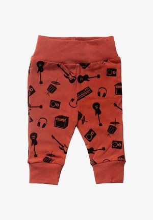 Rustfarvede bukser til småbørn med sorte print af musikinstrumenter, herunder guitarer, trommer, hovedtelefoner, keyboard og forstærkere, med ribbet talje og manchetter.