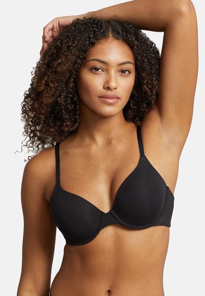 Sujetador negro acanalado con copas moldeadas y tirantes estrechos ajustables, con una textura suave y un diseño clásico.