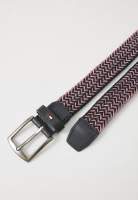 Woven fabric belt in navy with pink and white accents, featuring a rectangular metal buckle and leather strap ends for durability.