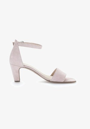 Sandali con tacco in suede rosa con cinturino alla caviglia, con parte posteriore chiusa, punta aperta e un modestissimo tacco a blocco, caratterizzati da una texture liscia e un design semplice.